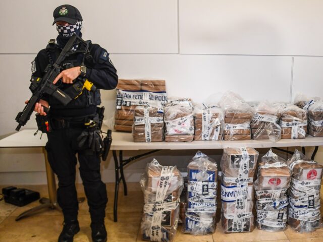 Australian Federal Police officers stand with approximately 350 kilograms (770 pounds) of