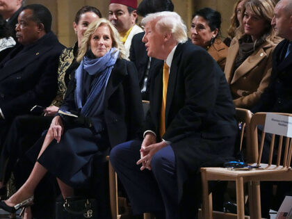 First Lady Jill Biden talks to President-elect Donald Trump sitting in Notre Dame Cathedra