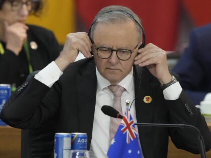 Australia's Prime Minister Anthony Albanese adjusts his headphones during the G20 Sum