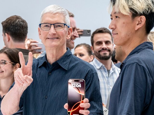 Apple's Tim Cook shows off the iPhone