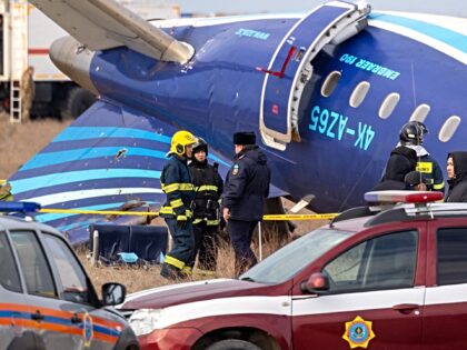 Emergency specialists work at the crash site of an Azerbaijan Airlines passenger jet near