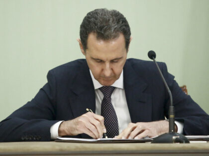 Syria's President Bashar al-Assad, seen during the Signing of the comprehensive progr