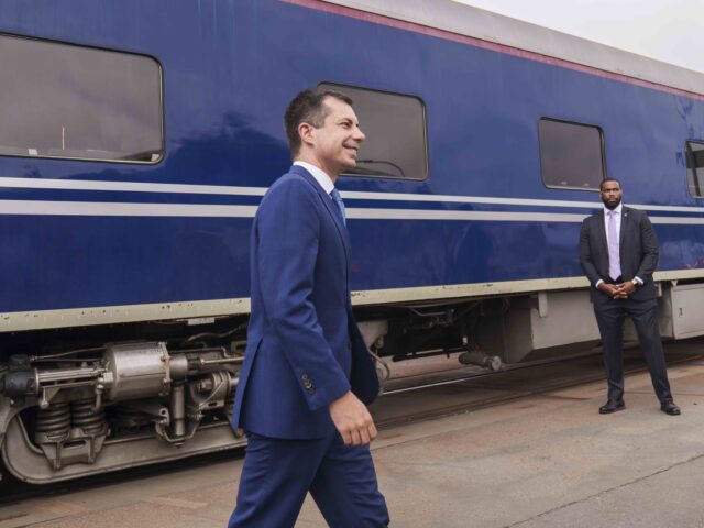 US Secretary of Transportation Pete Buttigieg steps off a railcar pulled by a PHL Joule Ze