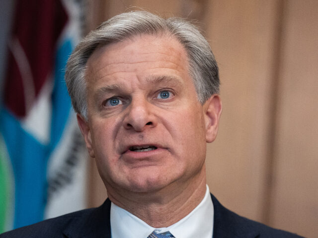  FBI Director Christopher Wray delivers opening remarks at a meeting of the Justice Depar