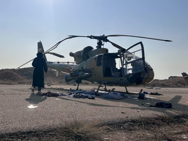 DAMASCUS, SYRIA - DECEMBER 09: Military vehicles and helicopters inside Mezzeh Air Base ar