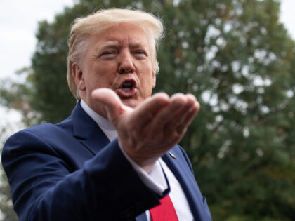 US President Donald Trump speaks to the press before departing the White House in Washingt