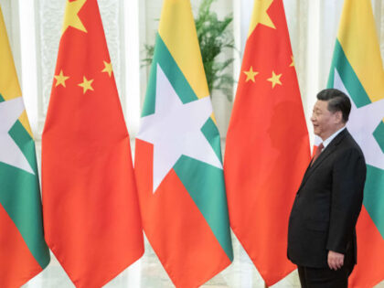 BEIJING, CHINA - APRIL 24: Chinese President Xi Jinping (C) arrives to meet Myanmar State