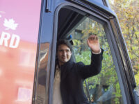 Justin Trudeau, Canada's prime minister, waves from the bus after voting in Montreal, Queb