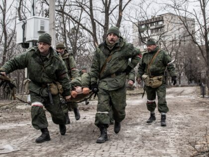 MARIUPOL, UKRAINE - 2022/03/27: Soldiers of the DNR (Donetsk People's Republic) run with a