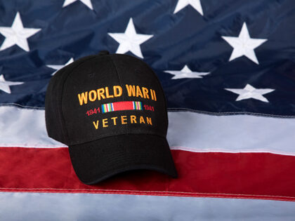 World War Two Veterans cap with American Flag background