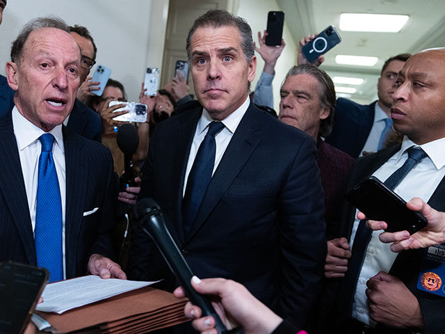 Hunter Biden, center, and his attorneys Abbe Lowell, left, address the media after leaving