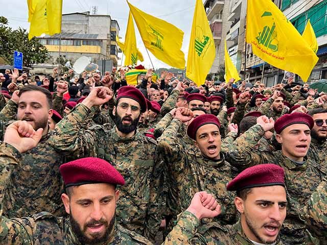 Hezbollah militants and supporters attend the funeral of Ali al-Debs, one of the militant