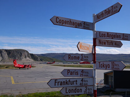 Passenger planes for local flights of Air Greenland stand on the tarmac at the airport as