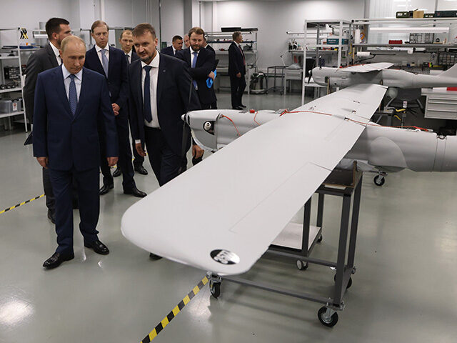 Russian President Vladimir Putin observes an exhibition of Orlan-10 UAV drones at the Spec