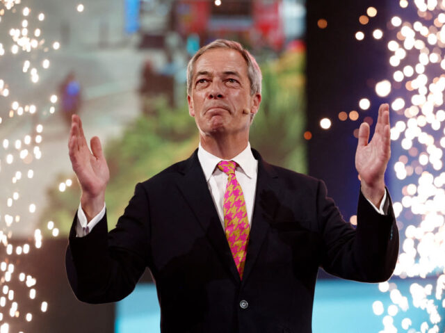 Reform UK party leader Nigel Farage reacts at the end of his speech on the opening day of