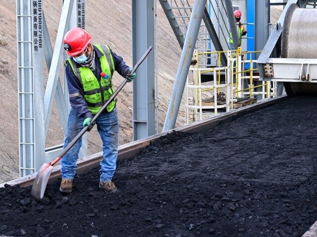 A staff member works at the Zhundong open-pit coal mine of Xinjiang Zhundong Energy Co., L