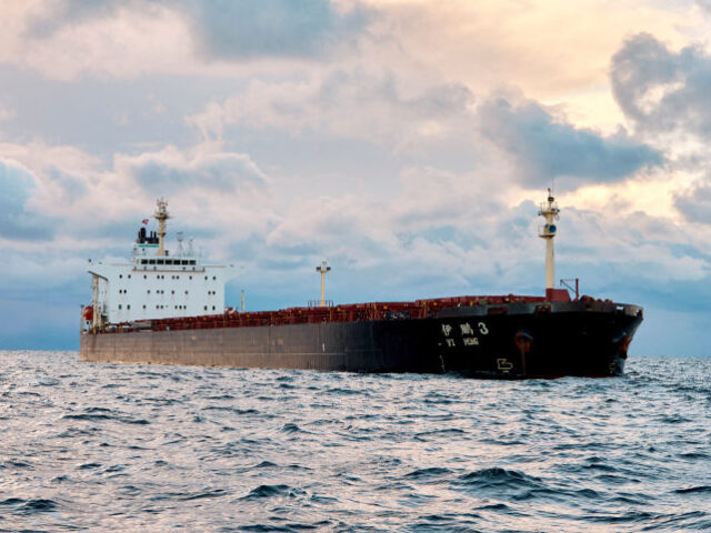 The Chinese ship, the bulk carrier Yi Peng 3 is anchored and being monitored by a Danish n