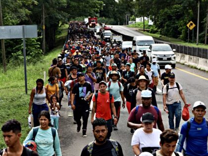 HUEHUETAN, MEXICO, -NOVEMBER 20: Migrants advance in caravan on their way to the United St