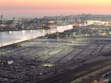 WILMINGTON, CALIFORNIA - DECEMBER 04: An aerial view of newly imported cars parked at the