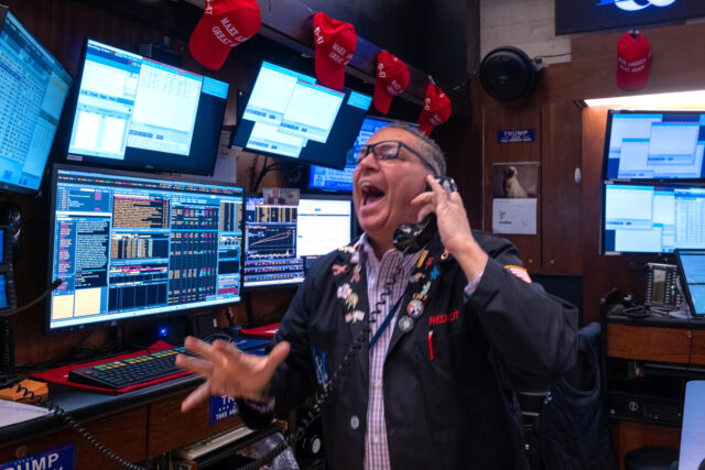 NEW YORK, NEW YORK - DECEMBER 18: Traders work on the New York Stock Exchange (NYSE) floor