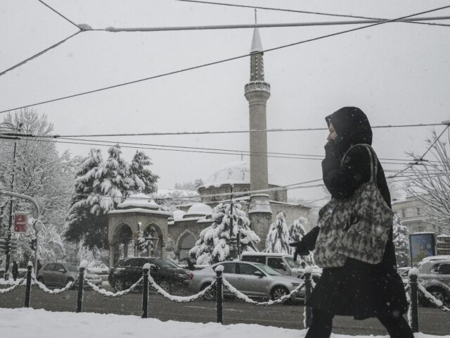 SARAJEVO, BOSNIA AND HERZEGOVINA - DECEMBER 24: People spend time during a snowy day in Sa