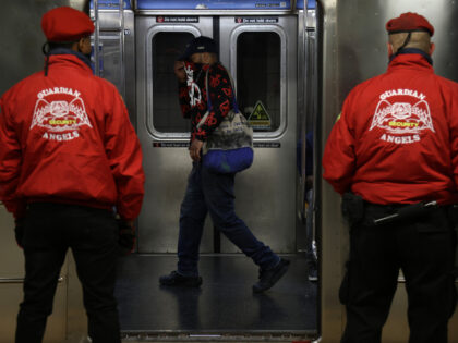 Members of the Guardian Angels participate in a safety patrol at a subway stop for prevent