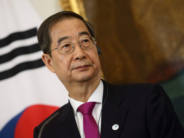 South Korea's Prime Minister Han Duck-soo attends a news conference after a meeting with A