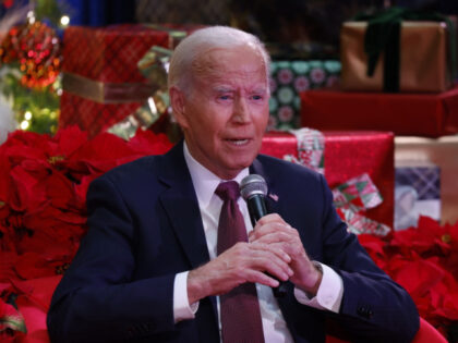 US President Joe Biden speaks during a holiday visit to patients and families at Children'