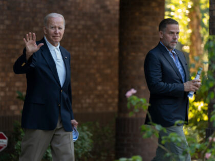 President Joe Biden with his son Hunter Biden waves as they leave Holy Spirit Catholic Chu