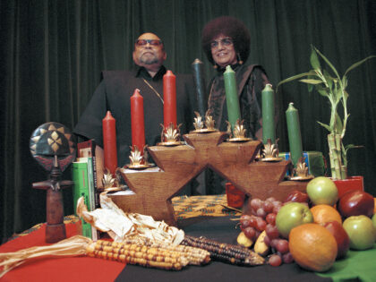 Portrait of African American author, activist, and professor Maulana Karenga with his wife