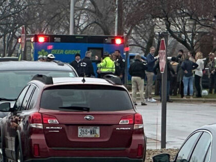 Emergency vehicles are parked outside of the SSM Health clinic where parents are being reu