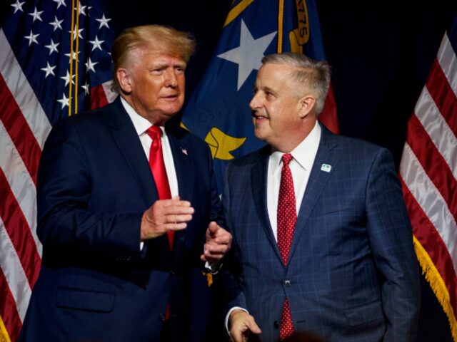 GREENVILLE, NC - JUNE 05: Former U.S. President Donald Trump, left, takes the stage with N