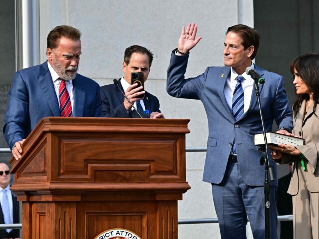 Nathan Hochman, with his wife Vivienne Vella, is sworn in by former California Governor Ar