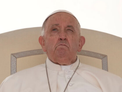 Pope Francis sits during his weekly general audience in St. Peter's Square, at the Va