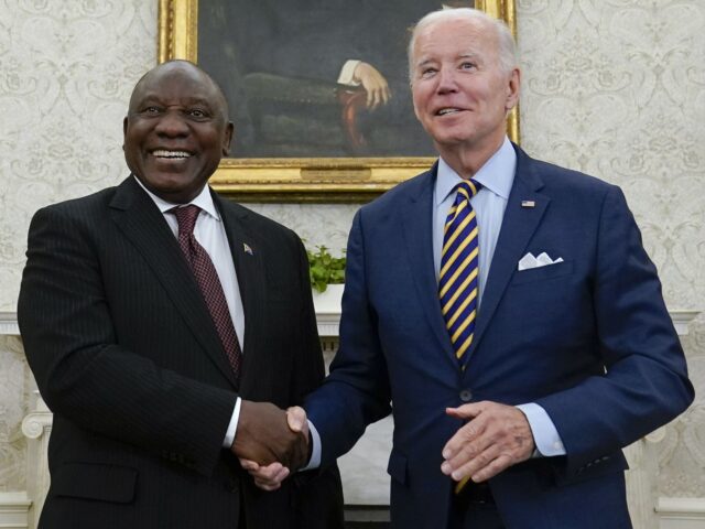 President Joe Biden shakes hands with South African President Cyril Ramaphosa as they meet