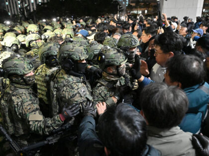 Soldiers try to enter the National Assembly building in Seoul on December 4 2024, after So