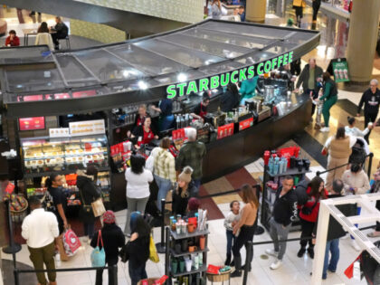 Black Friday shoppers line up at a Starbucks kiosk at the Walden Galleria in Buffalo, NY.,