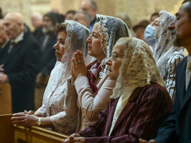 Syrian Christians attend Easter Sunday mass at the Fourty Martyrs Armenian church in the n