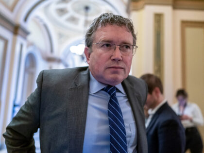 Rep. Thomas Massie, R-Ky., speaks to reporters outside the House chamber at the Capitol in