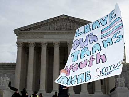 UNITED STATES - DECEMBER 4: Activists for and against trans rights protest outside the U.S