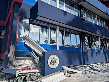 This photo shows a general view of a severely damaged building housing the embassies of th