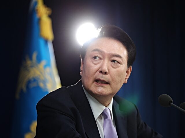 South Korean President Yoon Suk Yeol answers a reporter's question during a press conferen