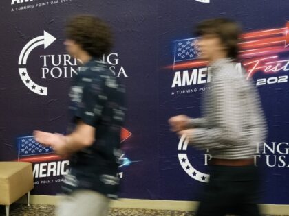 PHOENIX, ARIZONA - DECEMBER 18: People attend Turning Point USA’s America Fest 2021, a g