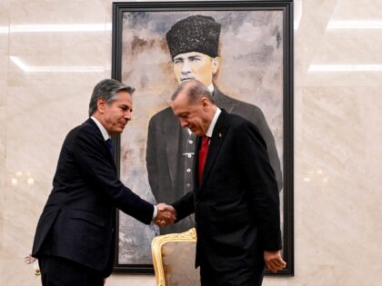 US Secretary of State Antony Blinken (L) shakes hands with Turkey's President Recep Tayyip