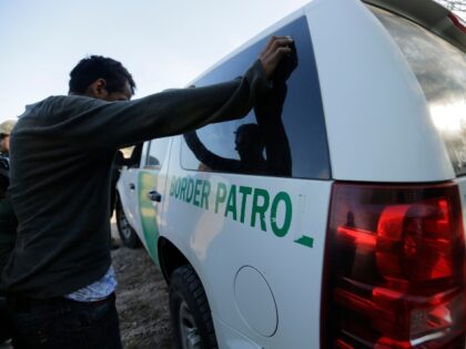 In this Wednesday, Nov. 6, 2019, photo, Border Patrol agents stop men thought to have ente