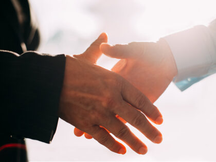 Close-up of business people hands shaking - stock photo