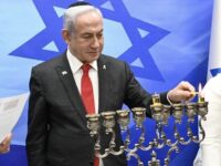 Netanyahu Warns Houthis as He Lights First Candle of Hanukkah