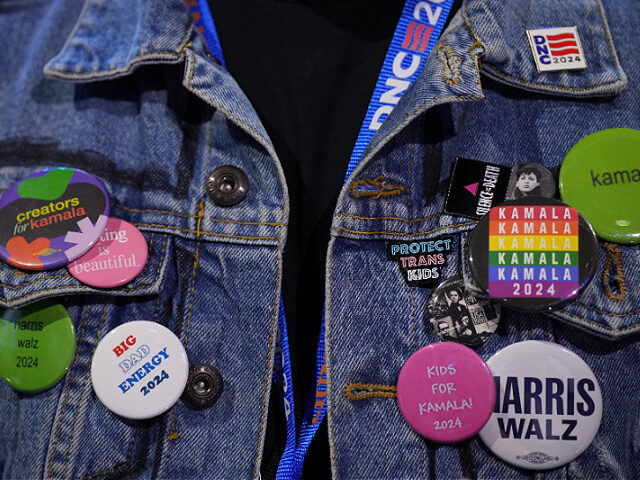 CHICAGO, ILLINOIS - AUGUST 21: Kamala Harris buttons and pins adorn an attendees' jean jac