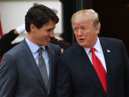 US President Donald Trump (R) welcomes Canadian Prime Minister Justin Trudeau at the White