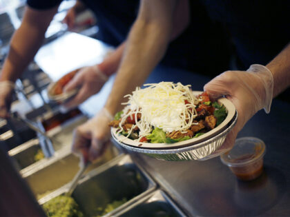 An employee prepares a burrito bowl at a Chipotle Mexican Grill Inc. restaurant in Louisvi